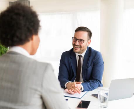 professional man interviewing woman candidate