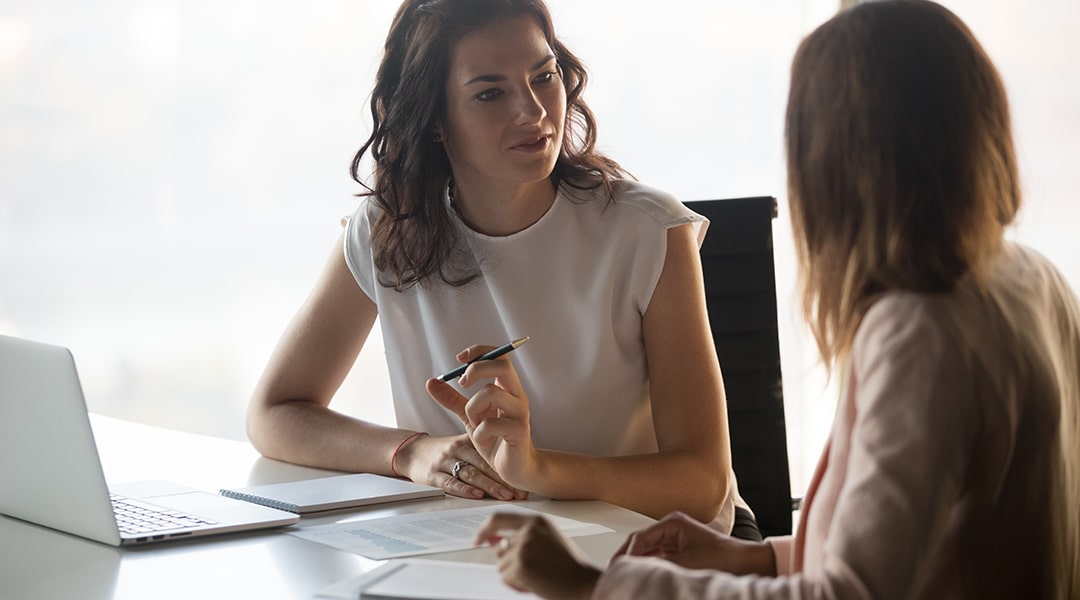 businesswoman interviewing woman executive candidate