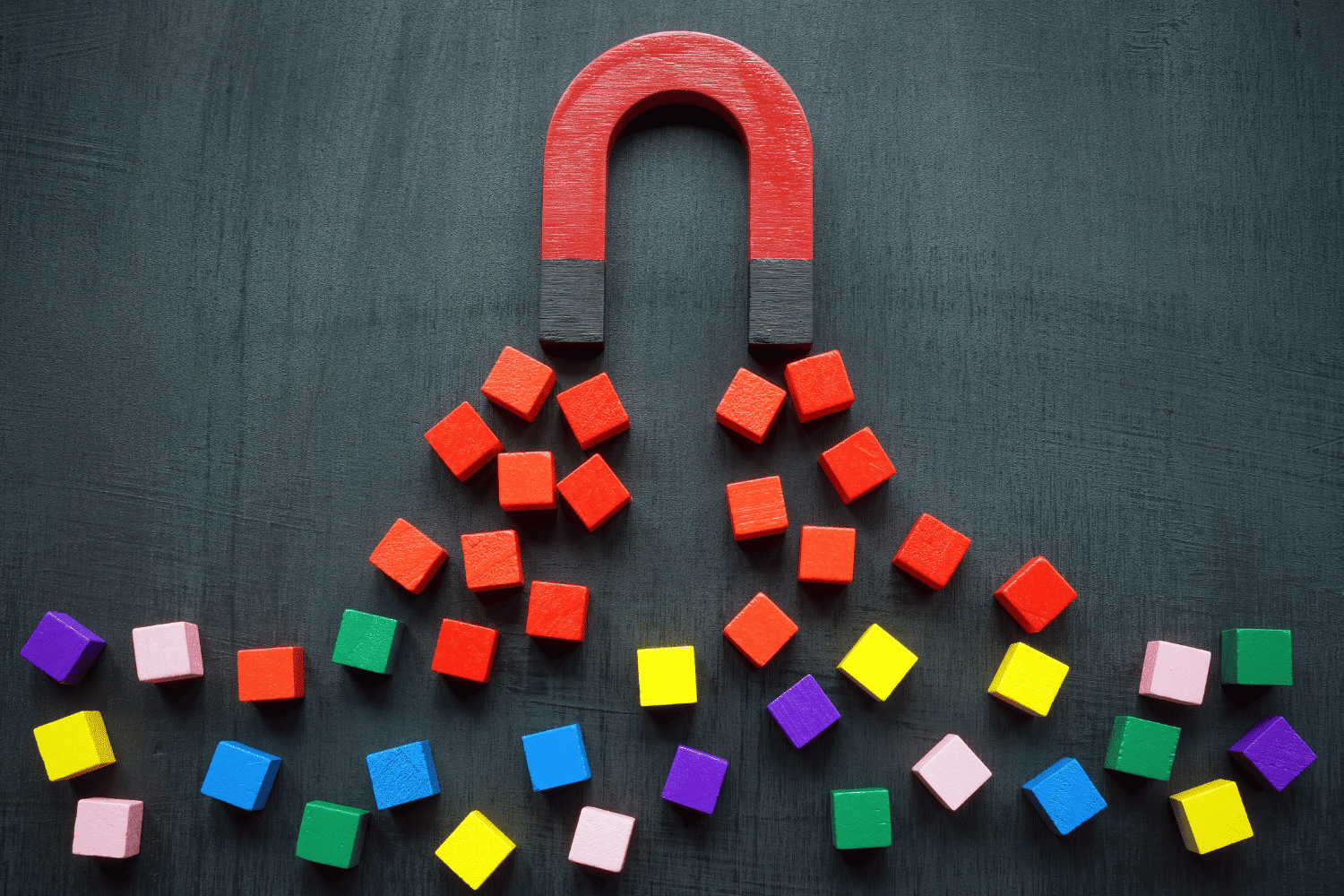 Magnet attracting different colored cubes