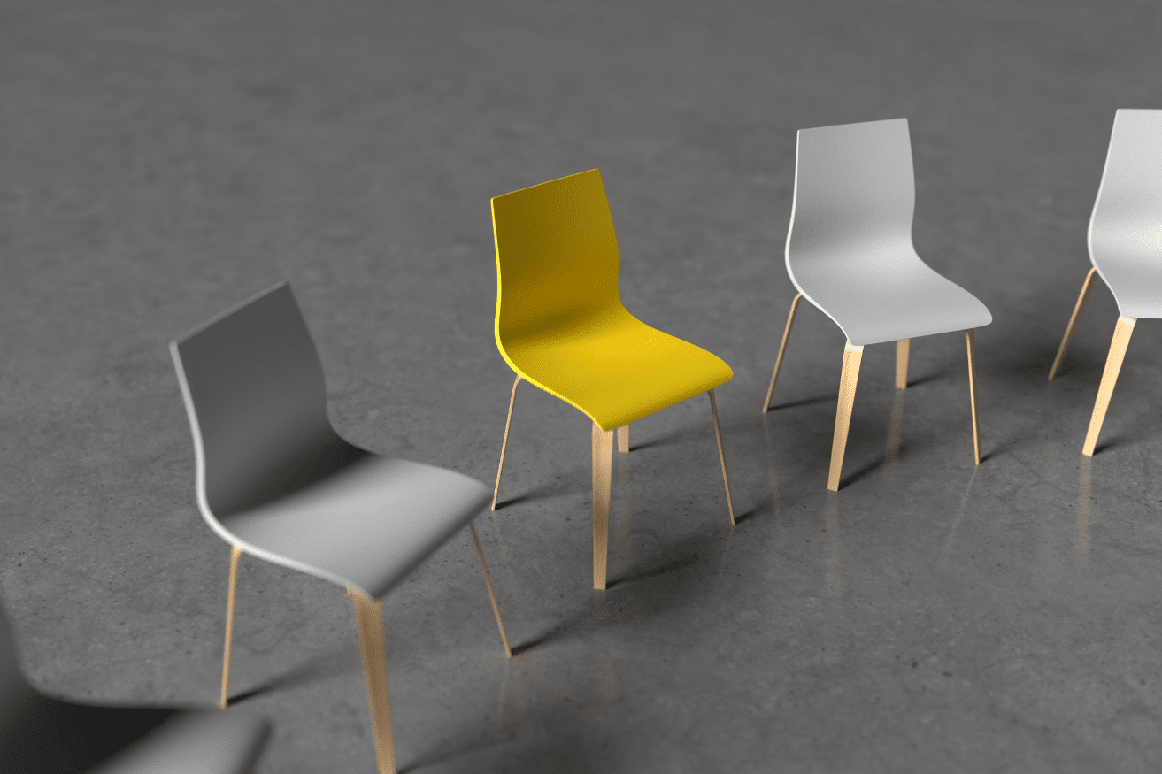 five empty chairs on a grey floor