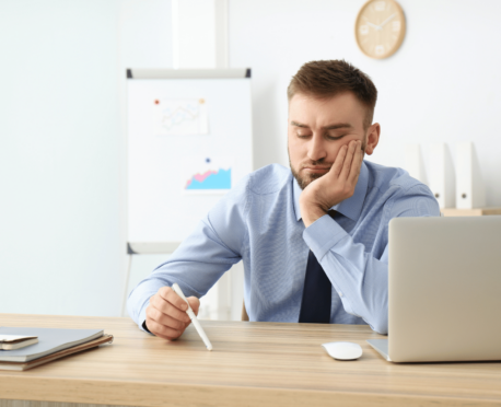 frustrated man working at a desk