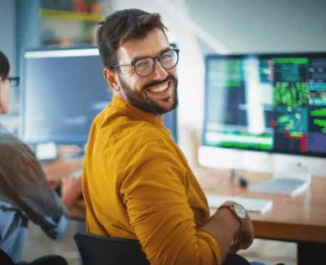 young technology professional working at computer