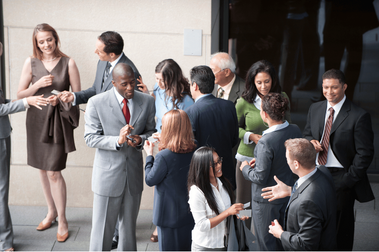 group of professional businesspeople at networking event