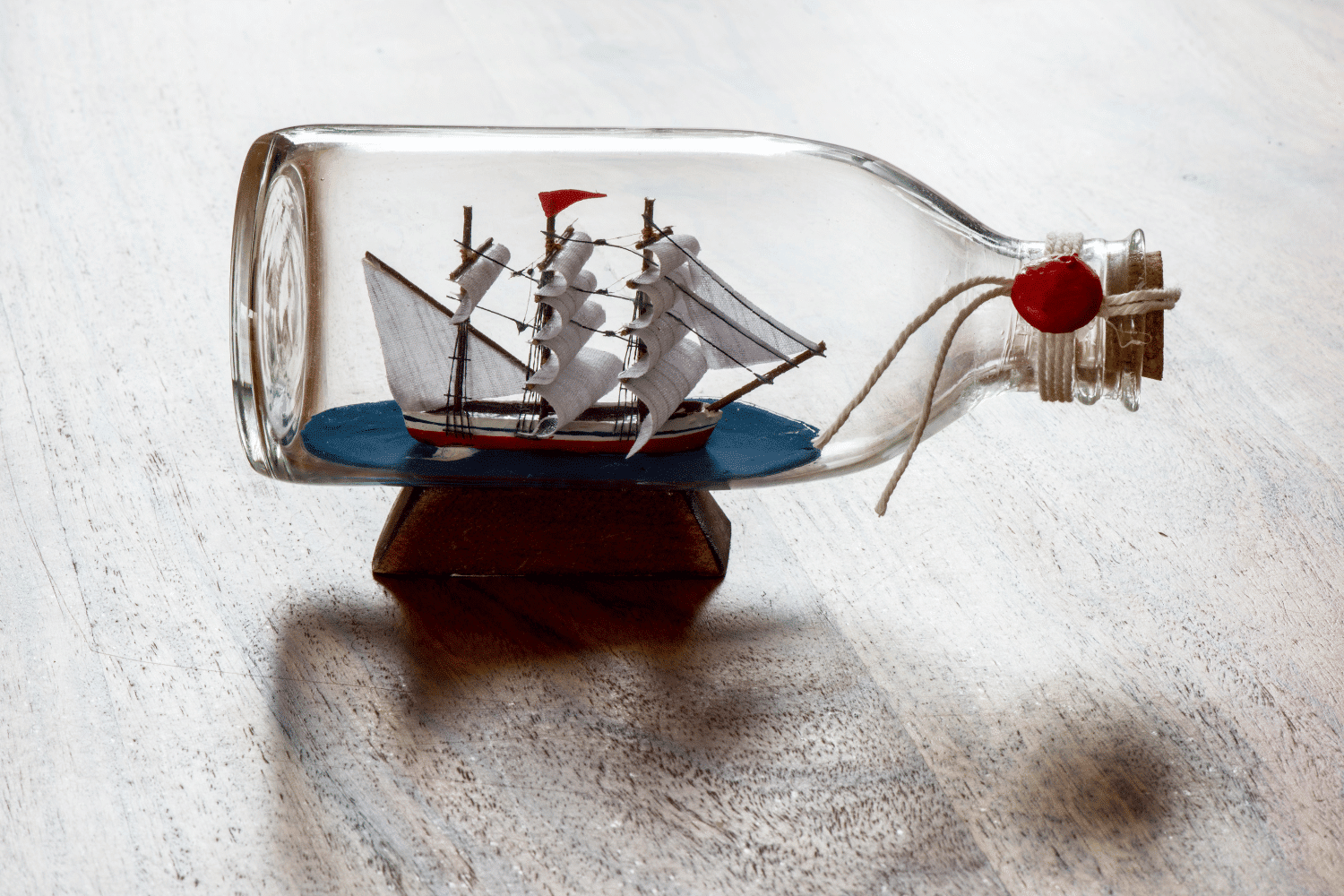 Tiny model sailing ship in a glass bottle