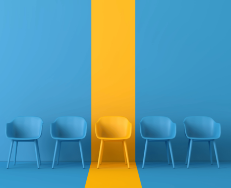 four empty blue chairs against blue background with one empty yellow chair against yellow background