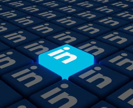 field of keyboard keys with the LinkedIn logo with one key protruding and lit up