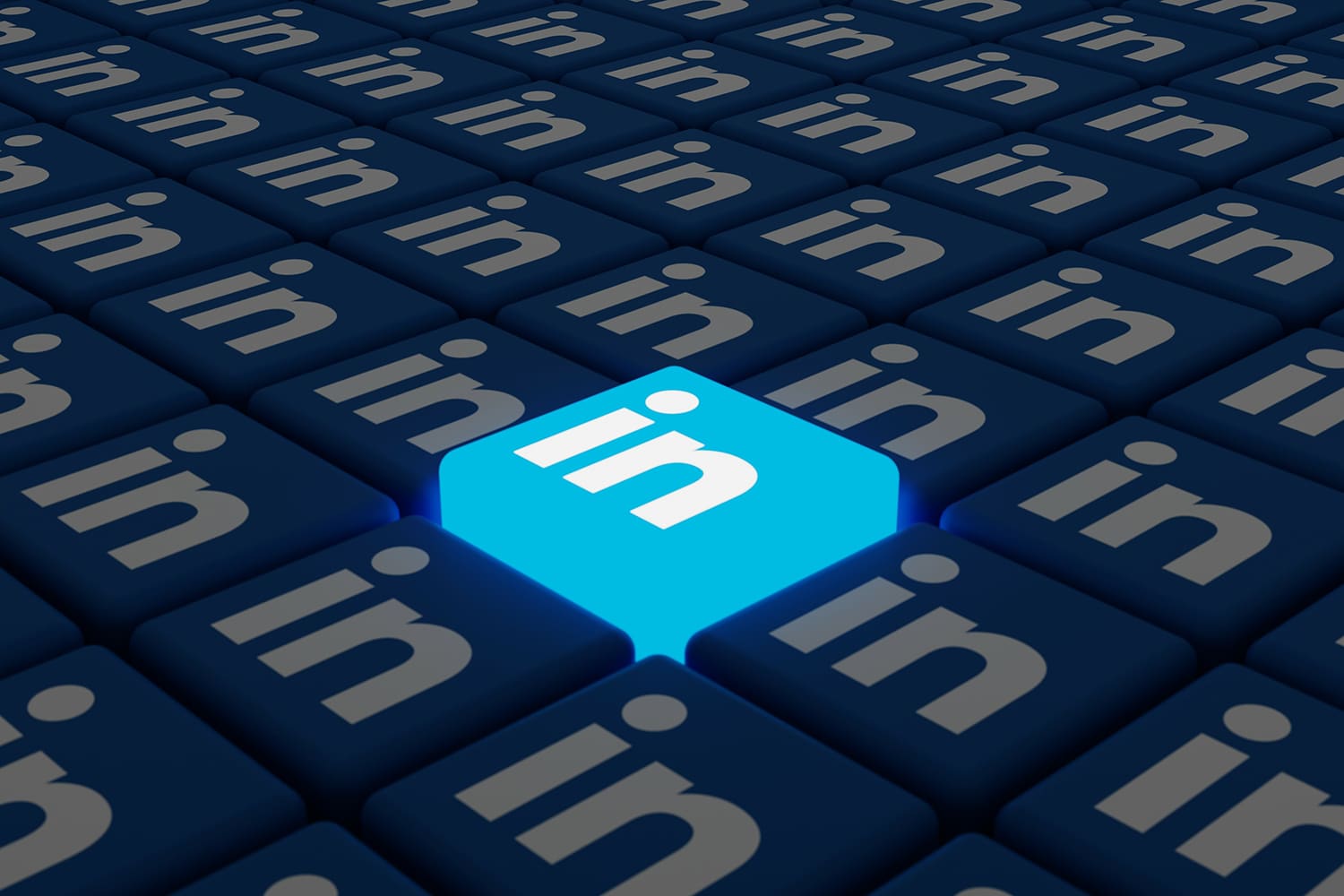 field of keyboard keys with the LinkedIn logo with one key protruding and lit up