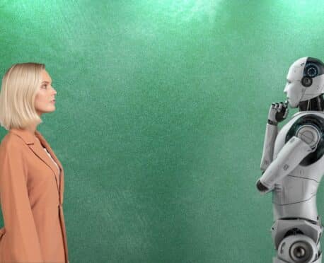 robot thinking about young professional woman in orange blazer on green background]
