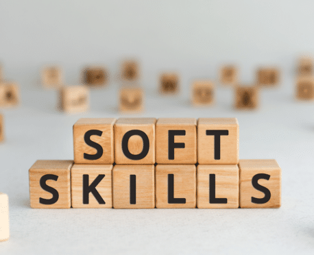 Small wooden blocks arranged to spell out SOFT SKILLS