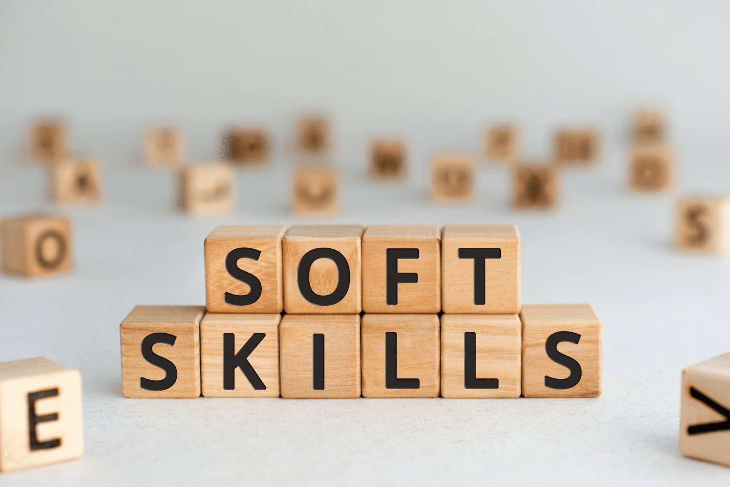Small wooden blocks arranged to spell out SOFT SKILLS