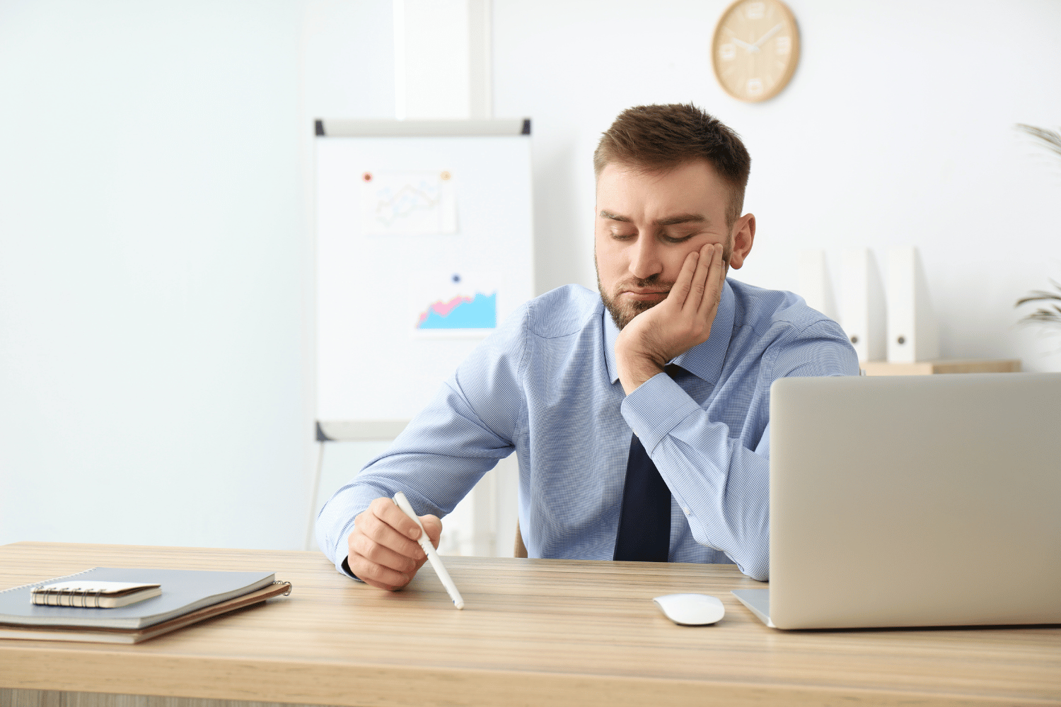 frustrated man working at a desk