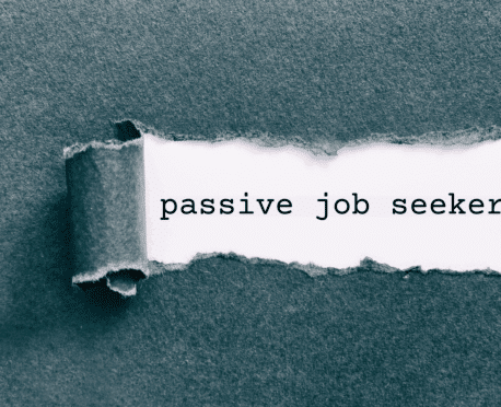 Metaphor for recruiting: torn paper revealing the phrase "passive job seekers." This image illustrates the hidden potential in the finance and accounting talent market and the specialized outreach strategies Oggi Talent uses to engage professionals who are currently employed but open to the right opportunity.