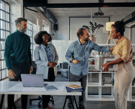 employee being welcomed back to the office by fellow employees
