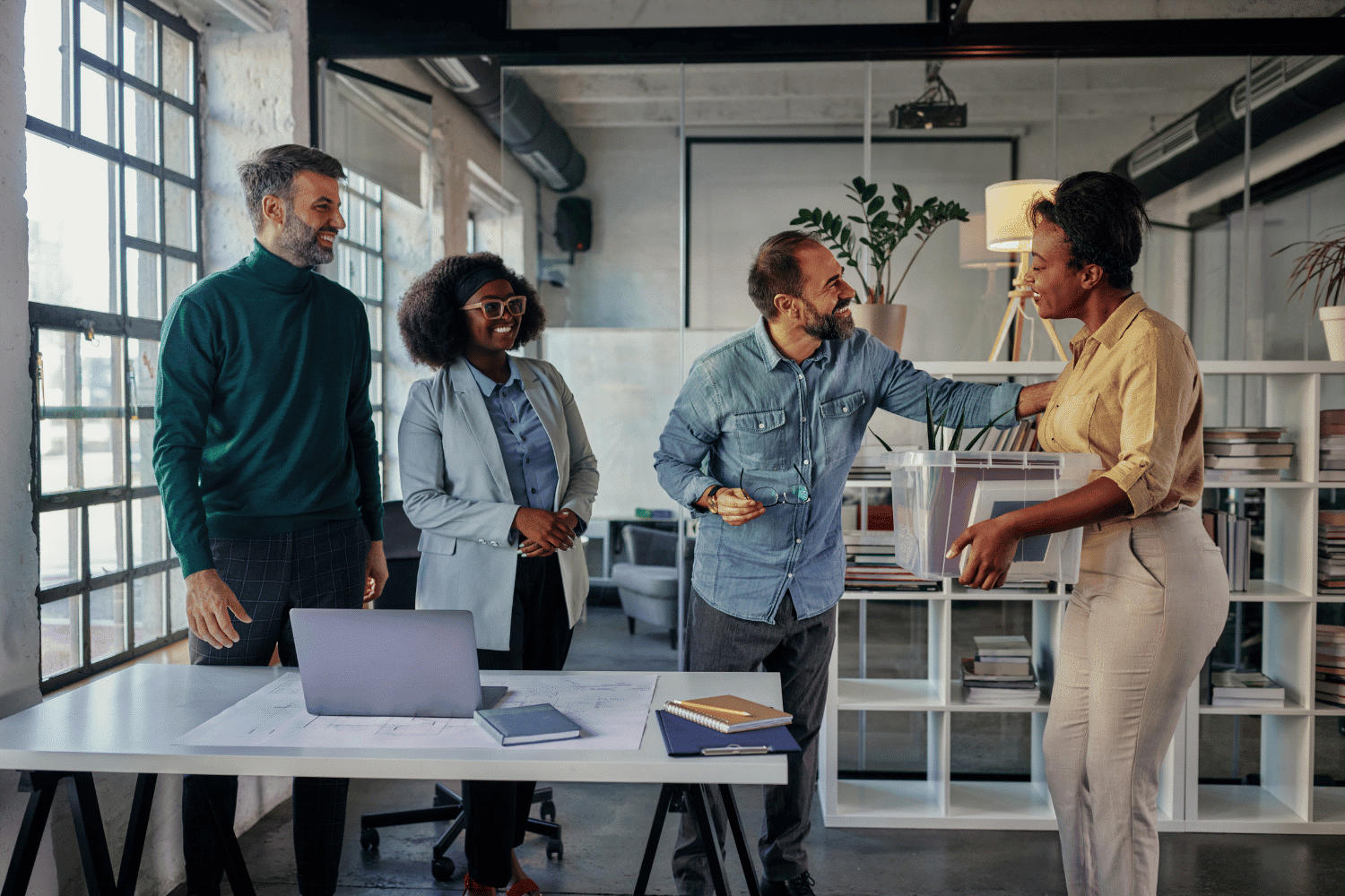 employee being welcomed back to the office by fellow employees