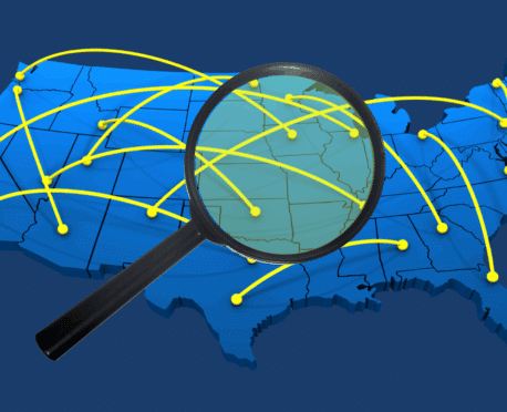 3D blue map of the US with interconnected yellow network lines, with a magnifying glass magnifying the central region, representing national reach for talent acquisition.