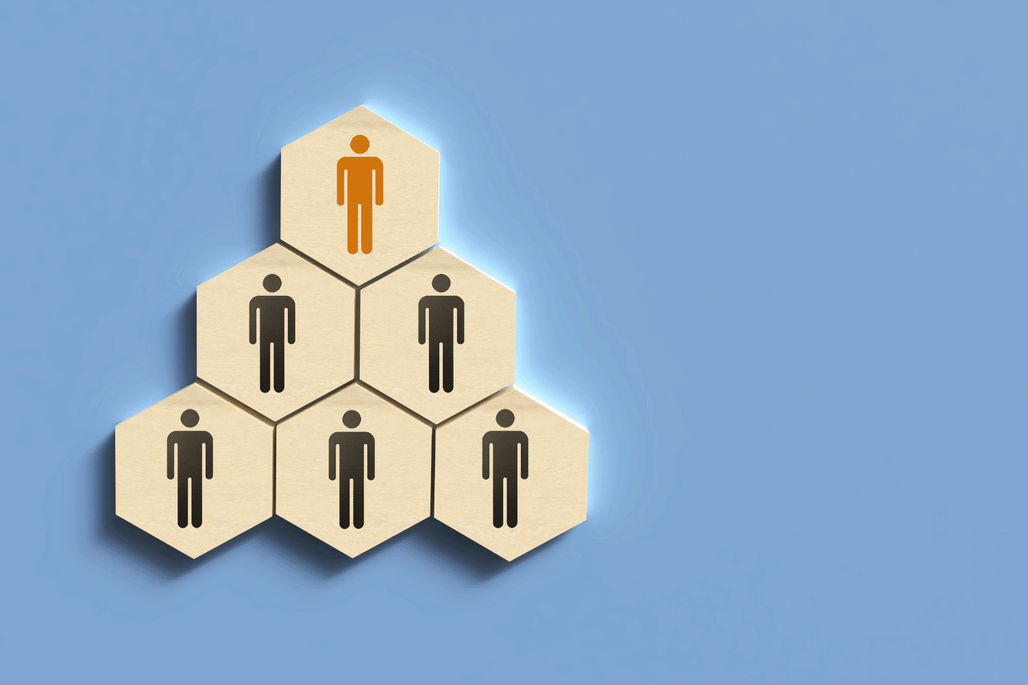 Conceptual graphic of a leadership hierarchy where the top executive is highlighted in orange. This illustrates the result of a strategic partnership between internal HR teams and search firms to identify and integrate the best-fit leadership talent.