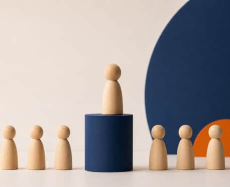 Seniorization and lean executive hiring represented by a senior leader elevated above a smaller team in a flat organization.