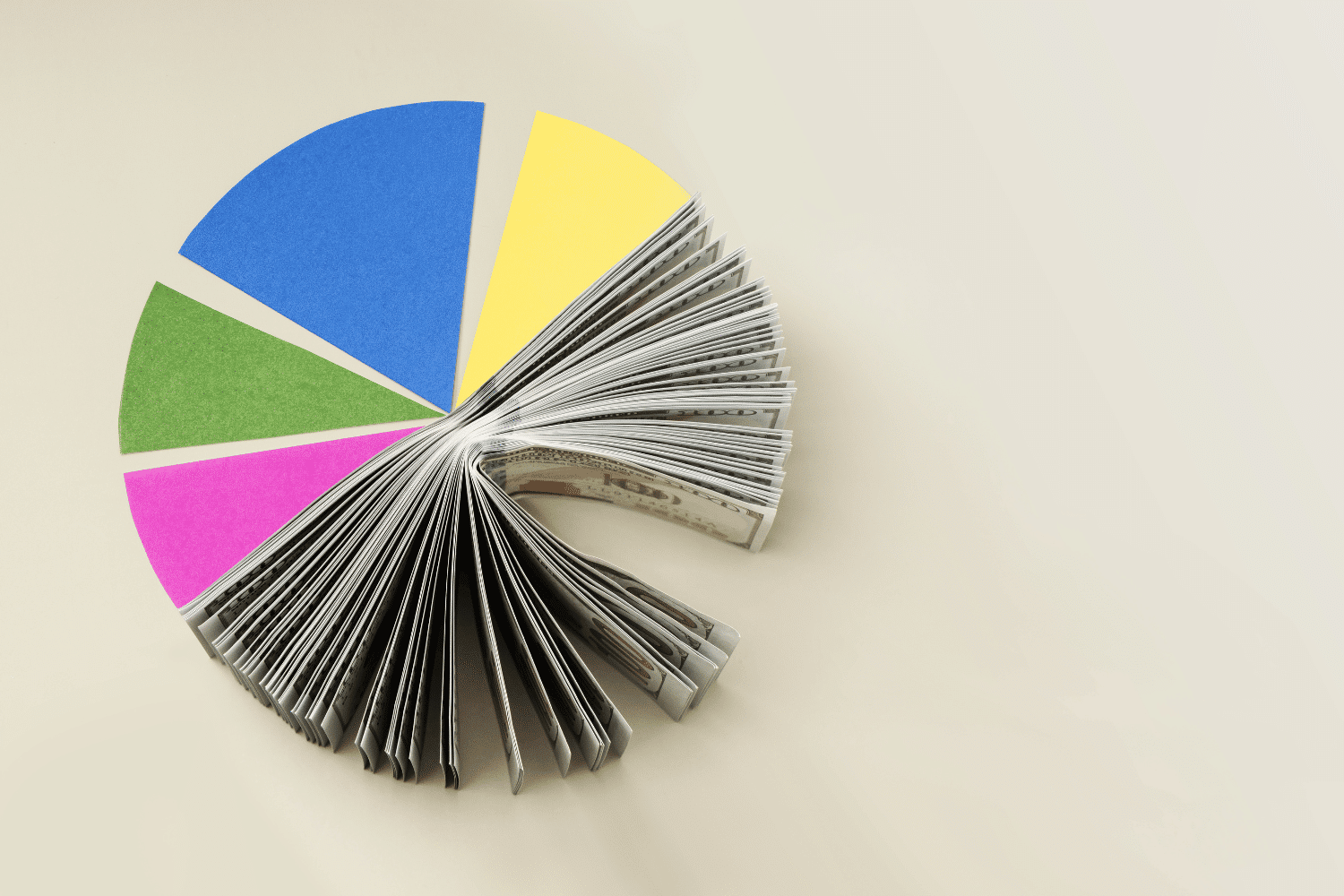 Colorful pie chart made from financial documents symbolizing tech-fluent CFO recruiting and finance leadership