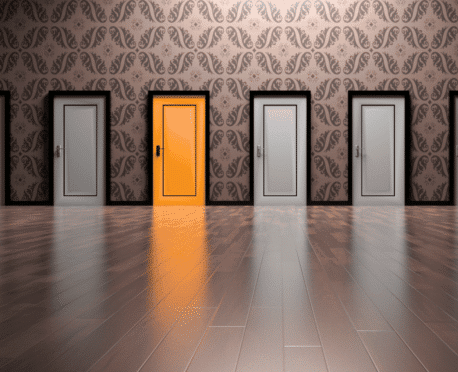 Row of doors with one open orange door, symbolizing choosing the right hiring model for a business need